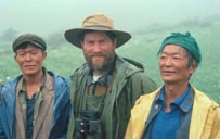 Jim Bland flanked by former monal hunters that have become guides